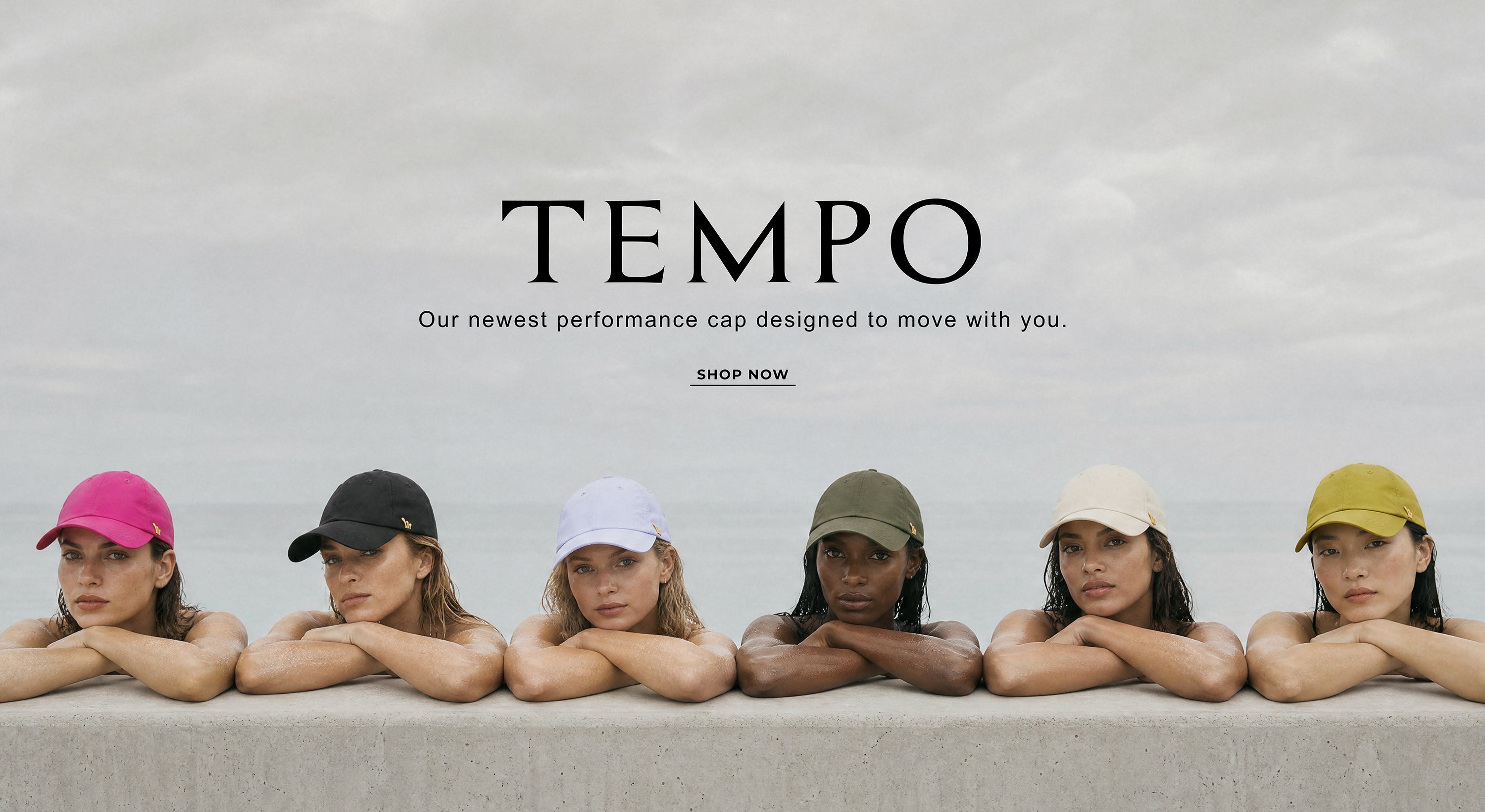Promotional banner for Tempo performance baseball caps. The top half shows six models wearing different colored Tempo caps (pink, black, white, green, beige, yellow) leaning on a concrete wall against an overcast sky.