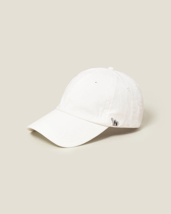 White baseball cap with silver hardware and an adjustable leather back strap.