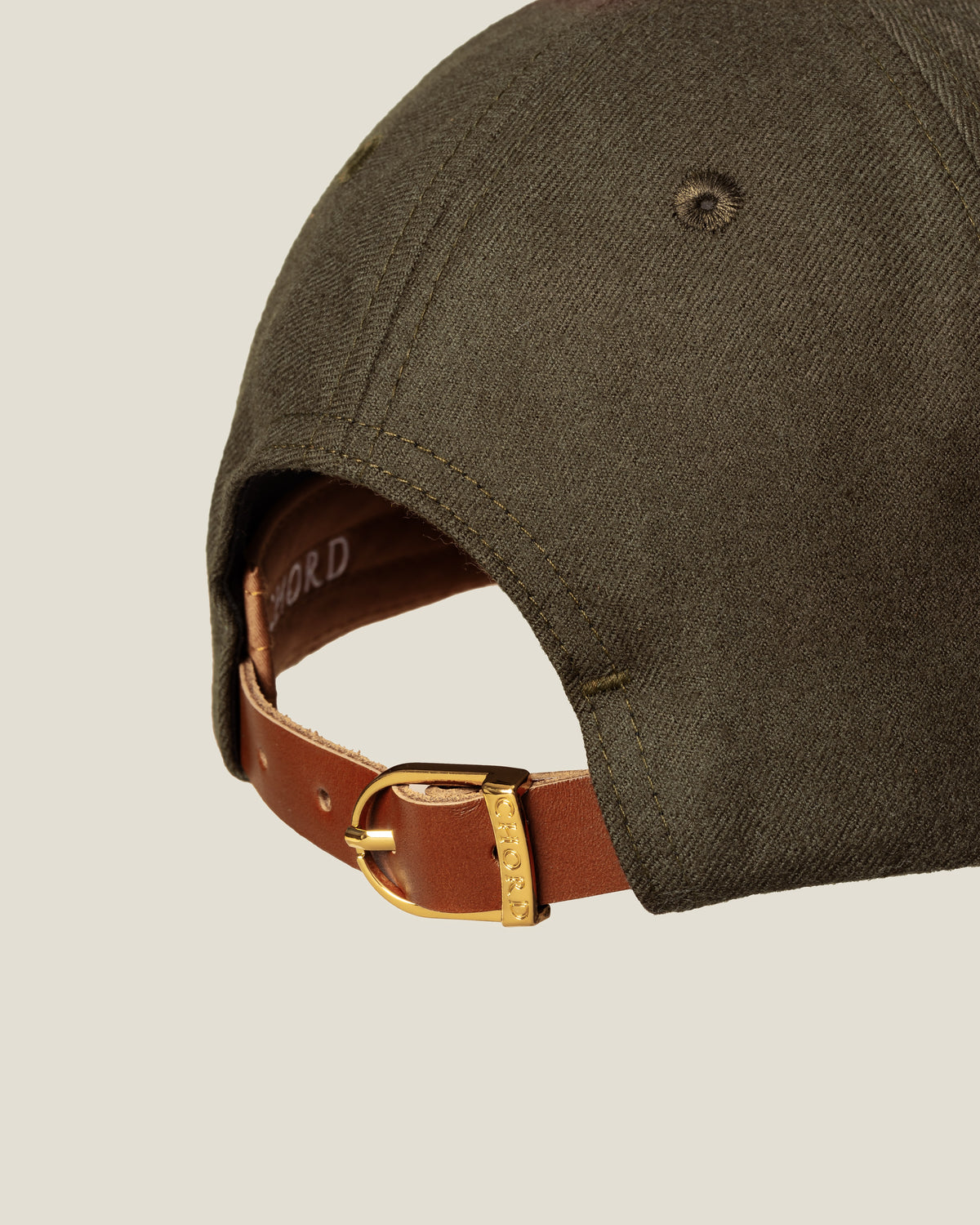 Aspen Wool women’s baseball cap by CHORD in olive green wool with gold-plated hardware